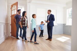 real estate in action with a family engaging the knowledgeable sales agent